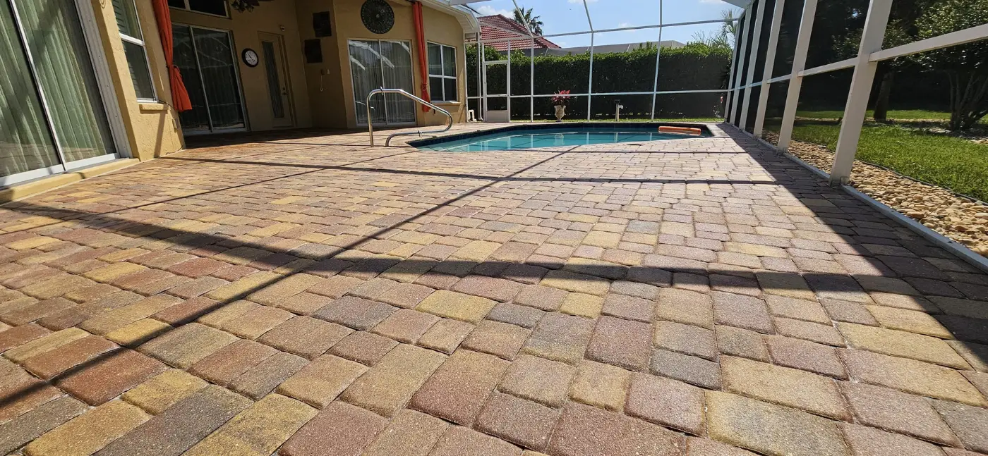 Sealed paver pool deck with screened enclosure